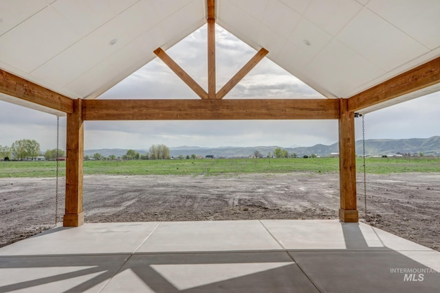 view of patio / terrace with a mountain view and a rural view