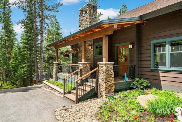 1460 Crown Point Pkwy, Cascade, ID 83611 - doorway to property featuring a chimney and covered porch