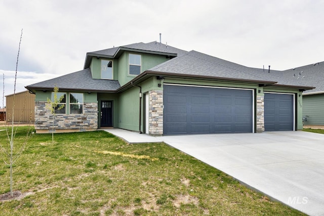 1113 W Blaine Ave, Nampa, ID 83651 - prairie-style house with driveway, stone siding, a garage, and a front lawn