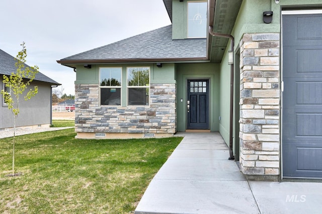 1113 W Blaine Ave, Nampa, ID 83651 - entrance to property featuring stone siding, a lawn, and stucco siding