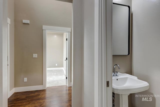 1113 W Blaine Ave, Nampa, ID 83651 - bathroom featuring wood finished floors, a sink, and baseboards