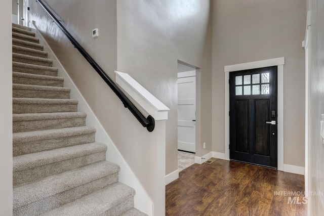1113 W Blaine Ave, Nampa, ID 83651 - foyer featuring stairway, a high ceiling, baseboards, and wood finished floors