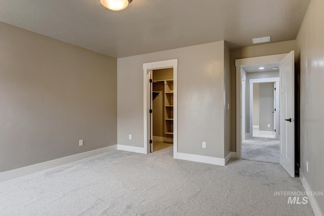 1113 W Blaine Ave, Nampa, ID 83651 - unfurnished bedroom featuring light colored carpet, baseboards, and a spacious closet