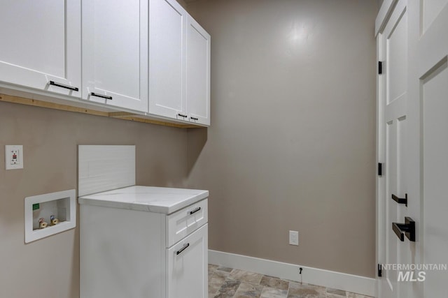 1113 W Blaine Ave, Nampa, ID 83651 - laundry room featuring washer hookup, baseboards, and cabinet space