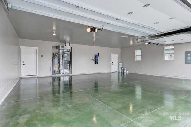 1113 W Blaine Ave, Nampa, ID 83651 - garage featuring a garage door opener, electric panel, and water heater