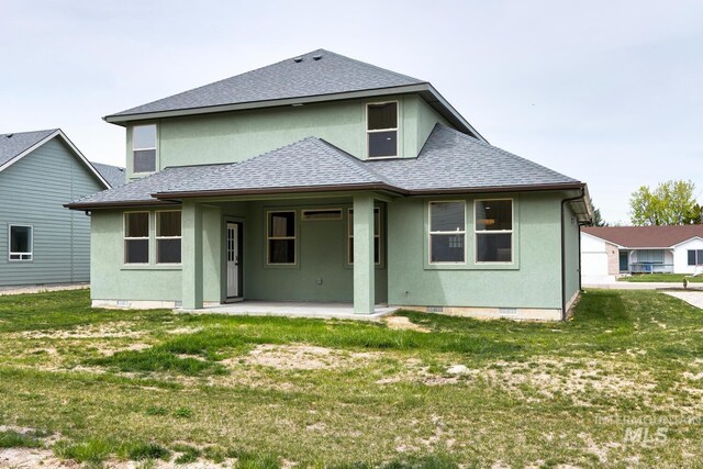 1113 W Blaine Ave, Nampa, ID 83651 - back of property featuring roof with shingles, a patio area, stucco siding, and a lawn
