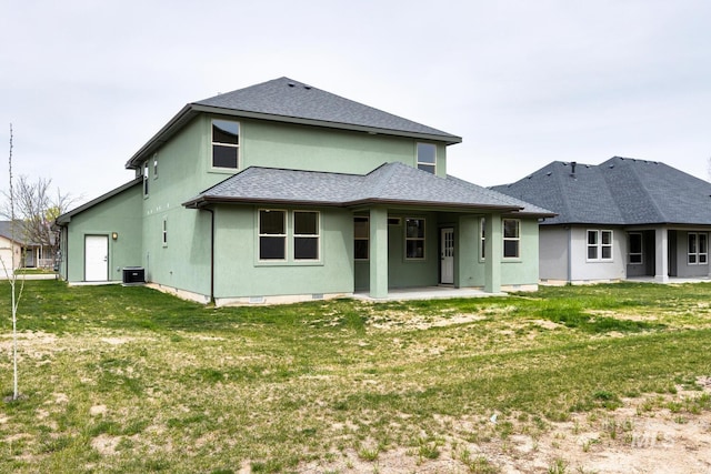 1113 W Blaine Ave, Nampa, ID 83651 - rear view of property with stucco siding, a lawn, a patio area, central AC unit, and a shingled roof