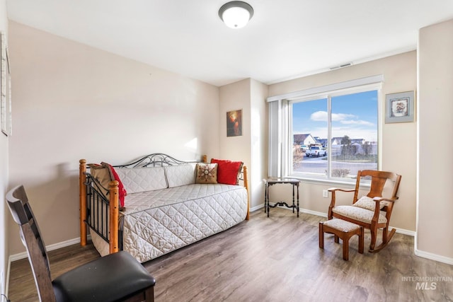 bedroom with hardwood / wood-style flooring