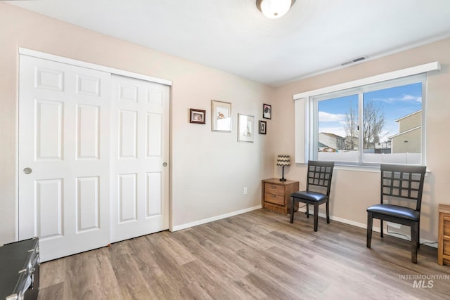 living area with light hardwood / wood-style floors