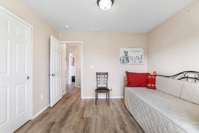 bedroom featuring wood-type flooring