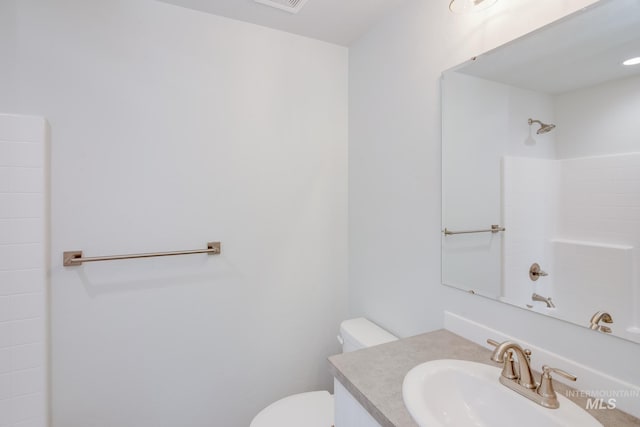 bathroom with vanity and toilet