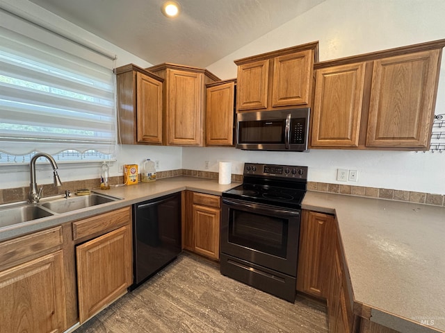 1173 Knoll Ridge Rd, Twin Falls, ID 83301 - kitchen with stainless steel microwave, black electric range, dishwasher, a sink, and vaulted ceiling