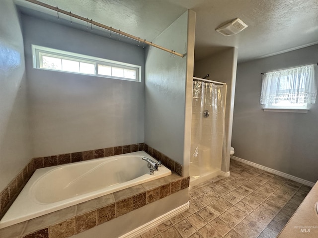 1173 Knoll Ridge Rd, Twin Falls, ID 83301 - full bath featuring a bath, a stall shower, toilet, and a textured ceiling