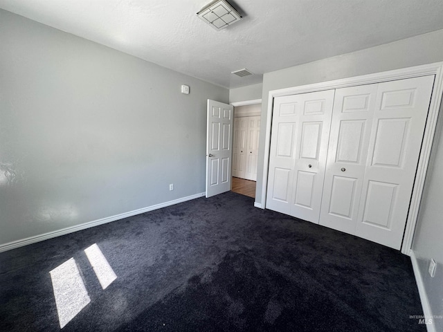 1173 Knoll Ridge Rd, Twin Falls, ID 83301 - unfurnished bedroom with dark carpet, baseboards, and a closet
