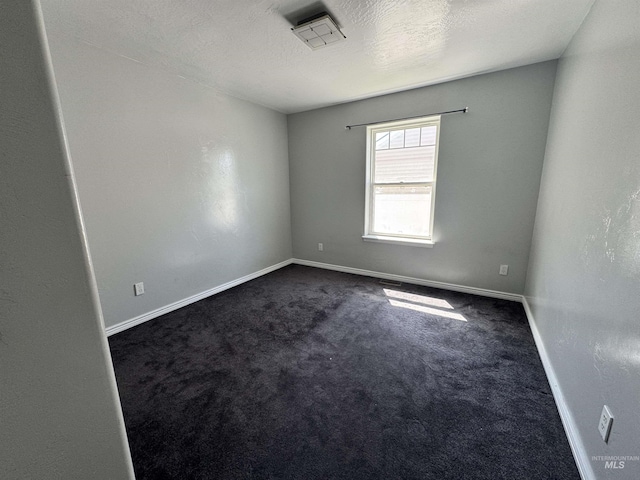 1173 Knoll Ridge Rd, Twin Falls, ID 83301 - empty room featuring dark carpet and baseboards