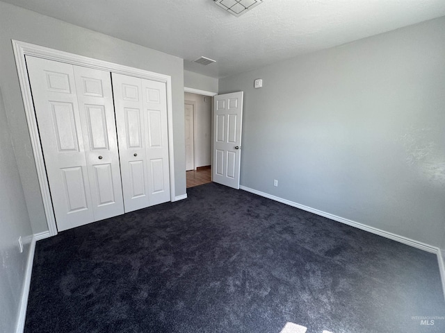 1173 Knoll Ridge Rd, Twin Falls, ID 83301 - unfurnished bedroom with dark carpet, baseboards, and a closet