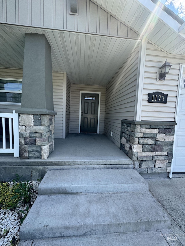 1173 Knoll Ridge Rd, Twin Falls, ID 83301 - doorway to property with stone siding and a porch