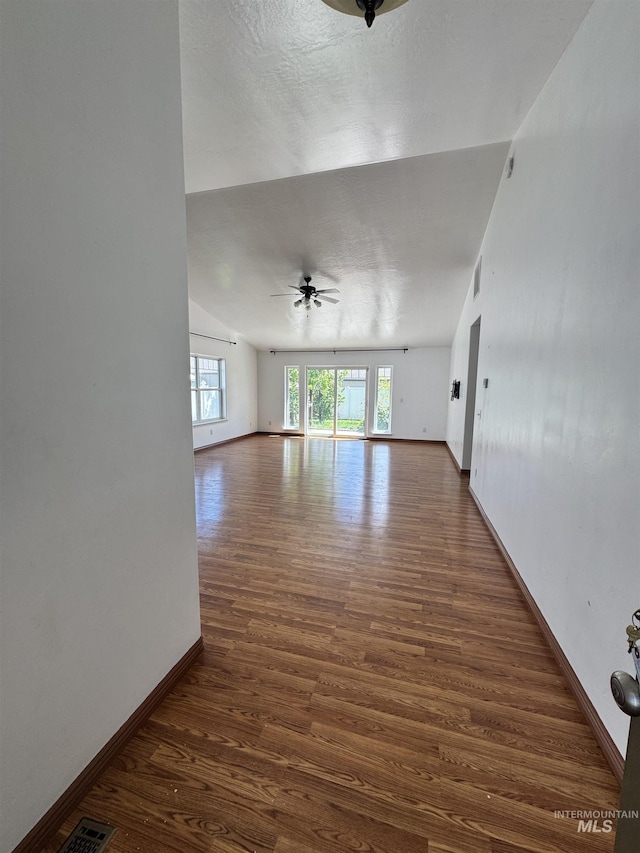 1173 Knoll Ridge Rd, Twin Falls, ID 83301 - empty room featuring ceiling fan, wood finished floors, baseboards, and lofted ceiling