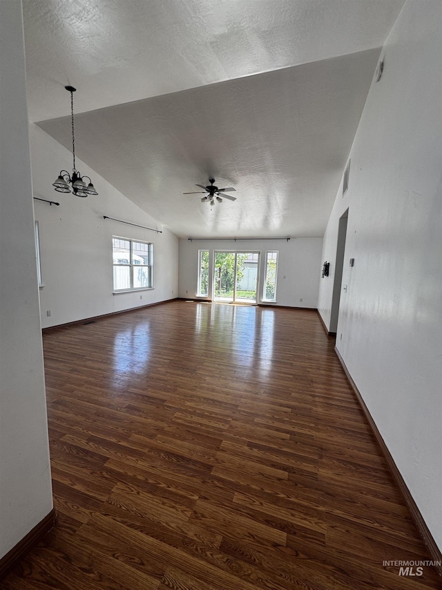 1173 Knoll Ridge Rd, Twin Falls, ID 83301 - unfurnished room featuring ceiling fan, wood finished floors, a chandelier, baseboards, and vaulted ceiling