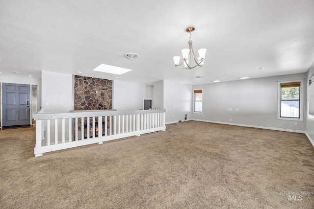 790 Academic Dr, Twin Falls, ID 83301 - empty room with a chandelier, a skylight, carpet flooring, and a wealth of natural light