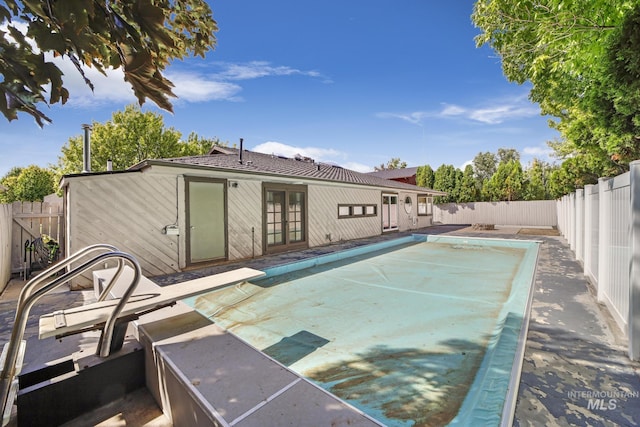 790 Academic Dr, Twin Falls, ID 83301 - rear view of property featuring french doors, a fenced backyard, and a patio area