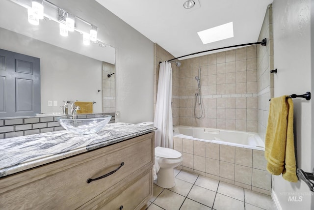 790 Academic Dr, Twin Falls, ID 83301 - bathroom with vanity, toilet, a skylight, tiled shower / bath combo, and tile patterned floors