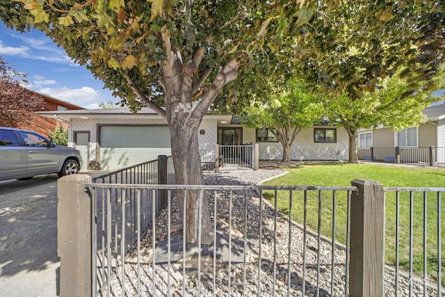 790 Academic Dr, Twin Falls, ID 83301 - view of front facade with a garage, a fenced front yard, concrete driveway, and a front lawn