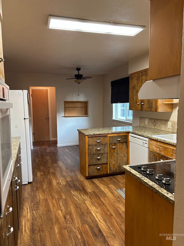 2320 S Illinois, Caldwell, ID 83605 - kitchen featuring white appliances, brown cabinets, a peninsula, ceiling fan, and dark wood-style floors