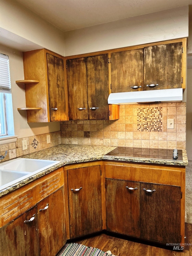 2320 S Illinois, Caldwell, ID 83605 - kitchen featuring under cabinet range hood, black electric stovetop, dark wood-type flooring, decorative backsplash, and open shelves