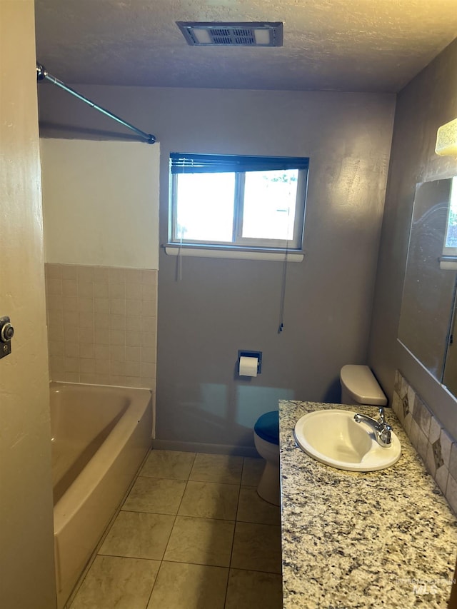 2320 S Illinois, Caldwell, ID 83605 - full bathroom with tile patterned flooring, vanity, and a textured ceiling
