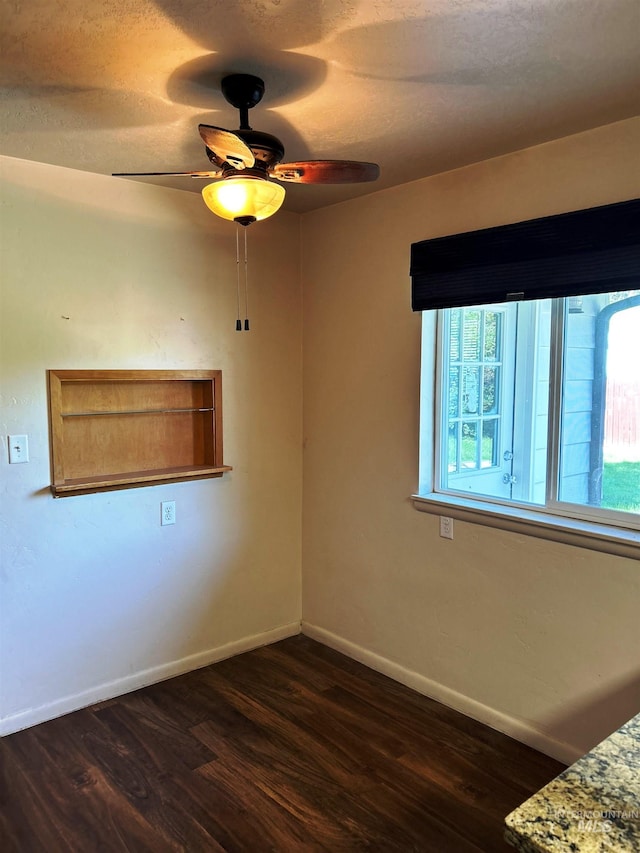 2320 S Illinois, Caldwell, ID 83605 - empty room with dark wood finished floors and ceiling fan