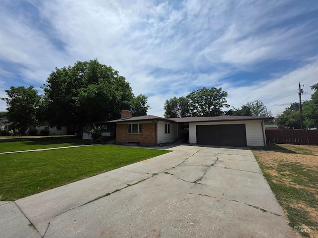 2320 S Illinois, Caldwell, ID 83605 - ranch-style house featuring an attached garage, concrete driveway, a chimney, and brick siding
