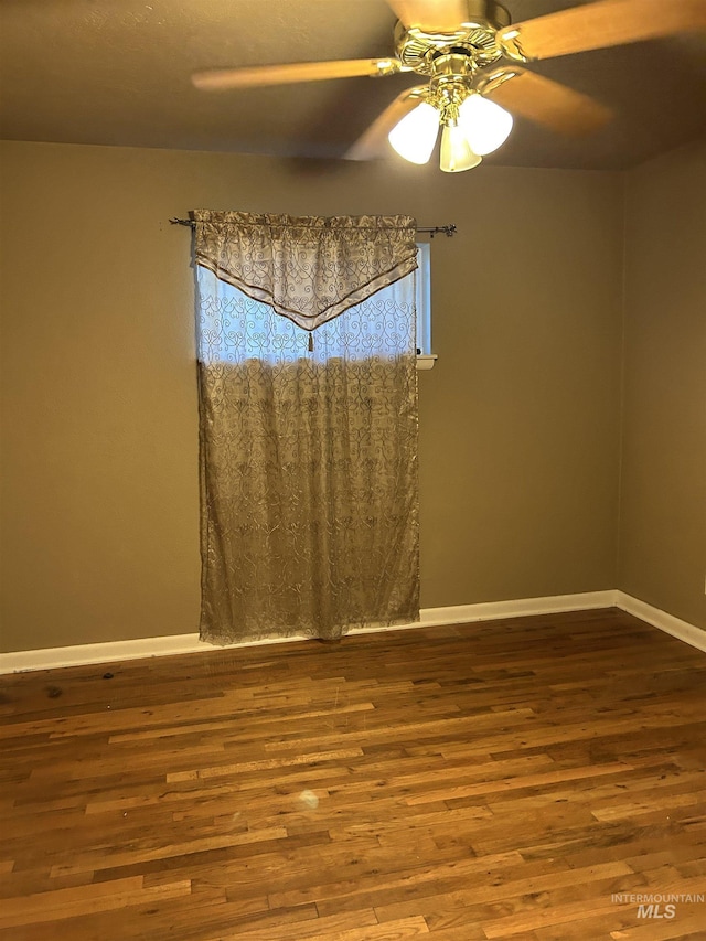 2320 S Illinois, Caldwell, ID 83605 - empty room with wood finished floors and a ceiling fan