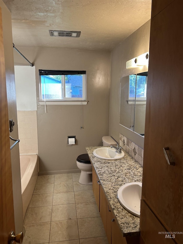 2320 S Illinois, Caldwell, ID 83605 - bathroom with healthy amount of natural light, tile patterned flooring, double vanity, shower / bath combination, and a textured ceiling