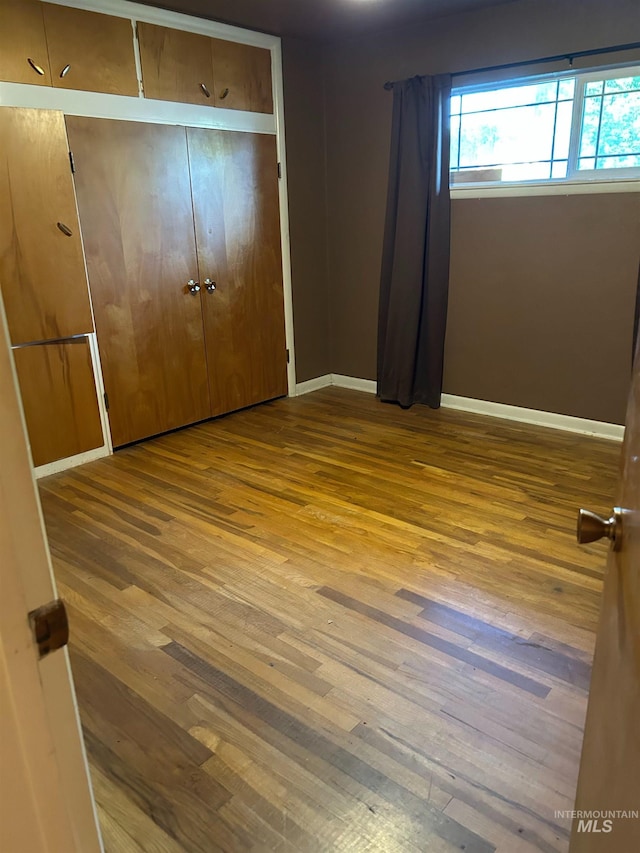 2320 S Illinois, Caldwell, ID 83605 - unfurnished bedroom featuring hardwood / wood-style floors and a closet