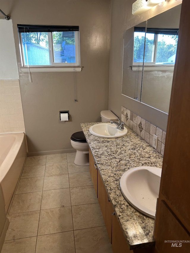 2320 S Illinois, Caldwell, ID 83605 - bathroom featuring plenty of natural light, a tub, double vanity, and tile patterned floors