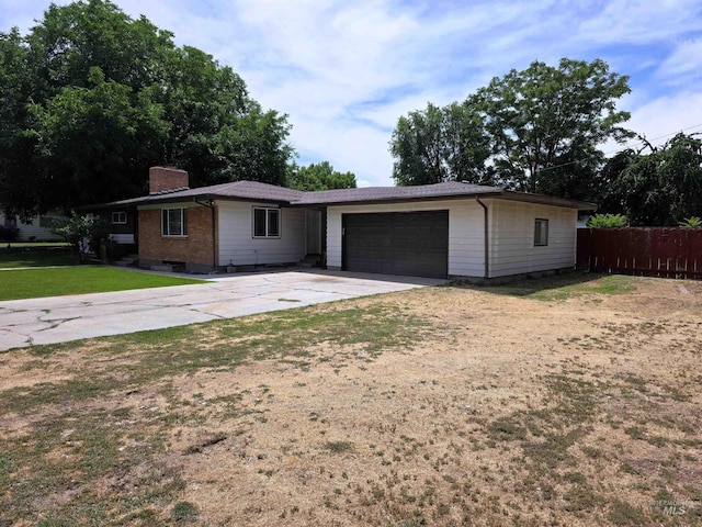2320 S Illinois, Caldwell, ID 83605 - single story home featuring concrete driveway, a chimney, and a garage
