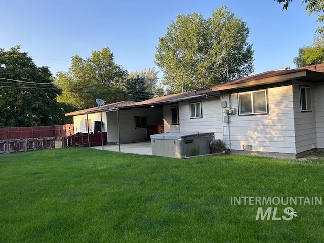2320 S Illinois, Caldwell, ID 83605 - back of property featuring a hot tub and a patio area