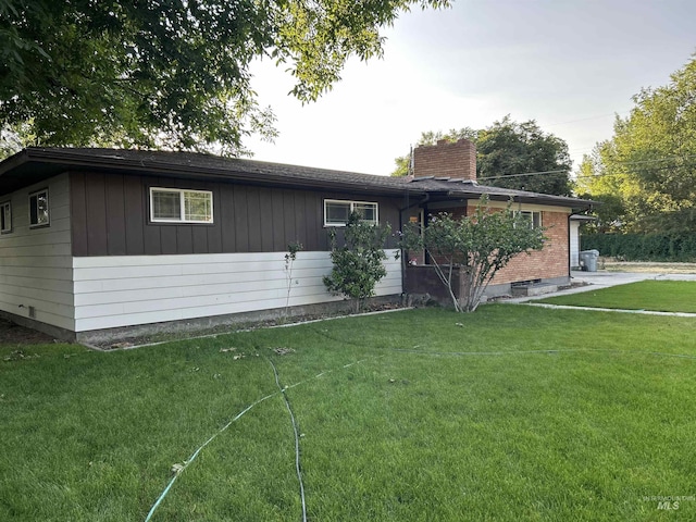 2320 S Illinois, Caldwell, ID 83605 - view of front of house with a chimney and a front yard