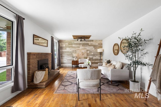 5928 W Grunder, Boise, ID 83709 - living area with a lit fireplace and hardwood / wood-style floors