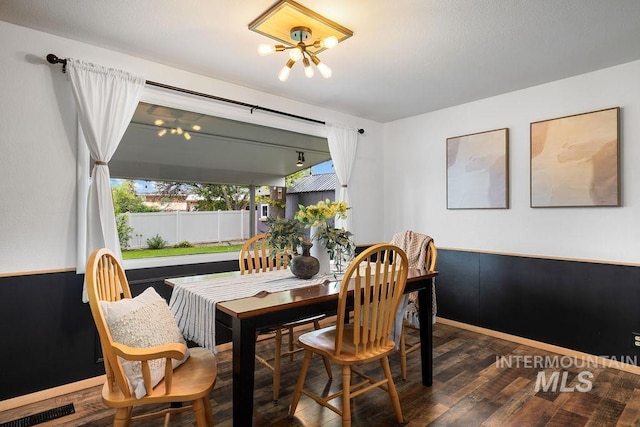 5928 W Grunder, Boise, ID 83709 - dining room featuring a chandelier, wood finished floors, and baseboards
