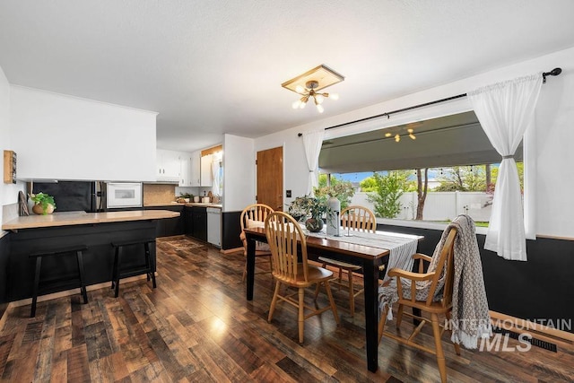 5928 W Grunder, Boise, ID 83709 - dining space featuring dark wood-style flooring