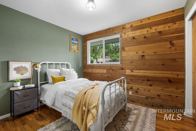 5928 W Grunder, Boise, ID 83709 - bedroom with wood finished floors and wood walls