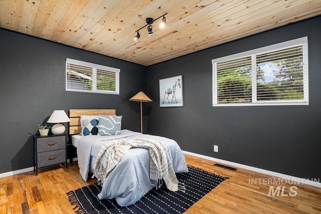 5928 W Grunder, Boise, ID 83709 - bedroom with wood finished floors, baseboards, and wood ceiling