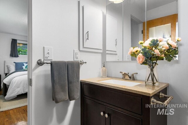 5928 W Grunder, Boise, ID 83709 - ensuite bathroom featuring vanity and wood finished floors