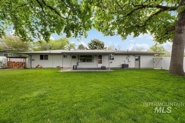 5928 W Grunder, Boise, ID 83709 - back of property with a patio area, a gate, and central air condition unit