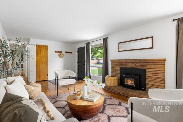 5928 W Grunder, Boise, ID 83709 - living area featuring wood finished floors and a stone fireplace