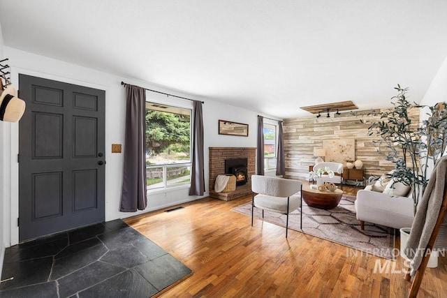 5928 W Grunder, Boise, ID 83709 - living area with a lit fireplace and wood finished floors