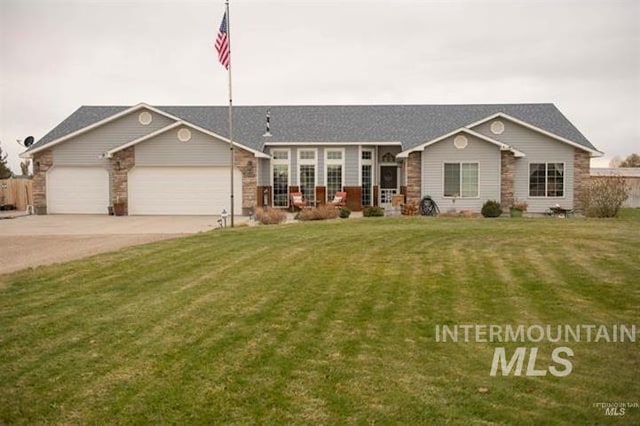 single story home with a garage and a front lawn