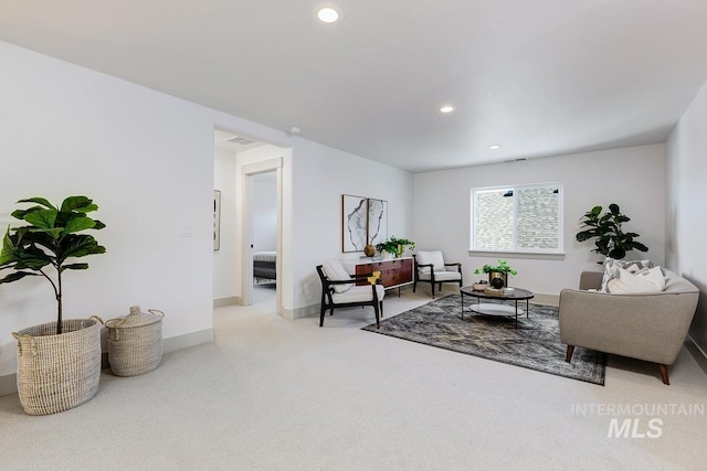 living room with carpet flooring, recessed lighting, and baseboards